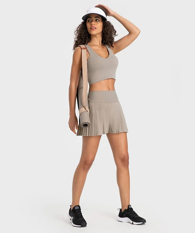 Sieviešu vienkrāsains vasaras tenisa apģērbs Seksīgs sacīkšu krūšturis kroku svārki Divdaļīgs sporta komplekts Sporta tērps Sieviešu elpojošs sporta apģērbs