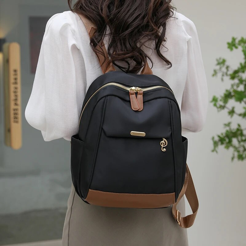 2023. gads. Jauna, liela ietilpība vienkārša stila brīvā laika sieviešu mugursoma neilona ūdensnecaurlaidīga auduma modes sieviešu plecu somas Ceļojumu somas