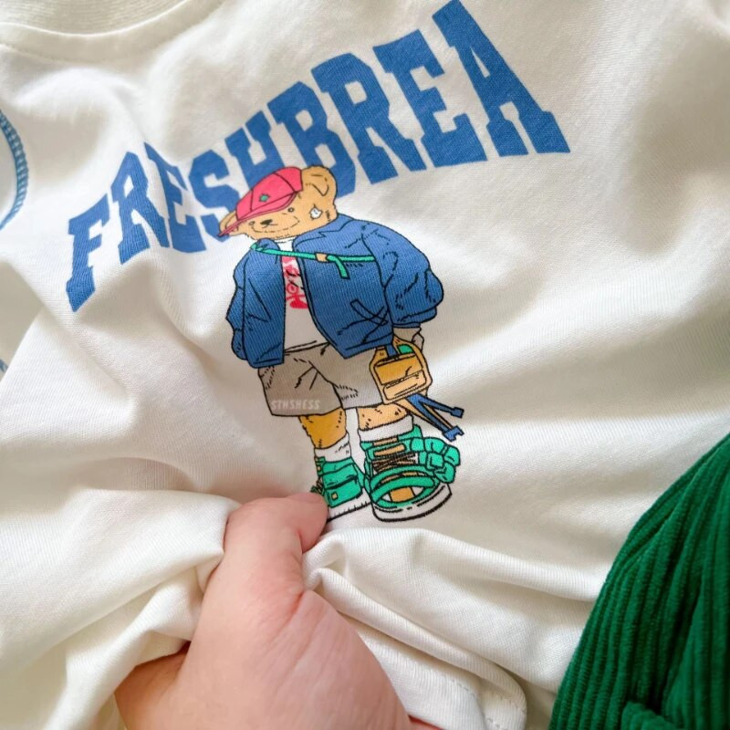 2023 Kids Uus puuvillane pikkade varrukatega trükitud T-särk poistele tüdrukutele armsad multikad Laste ühevärvilised pehmed vabaaja pikkade varrukatega topid