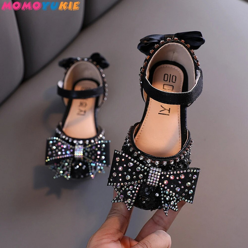 2022. g. Jaunas meiteņu kurpes Bērnu snieguma apavi Sequins Rhinestone Princess ar tauriņmezglu plakaniem apaviem Studentu deju sandales
