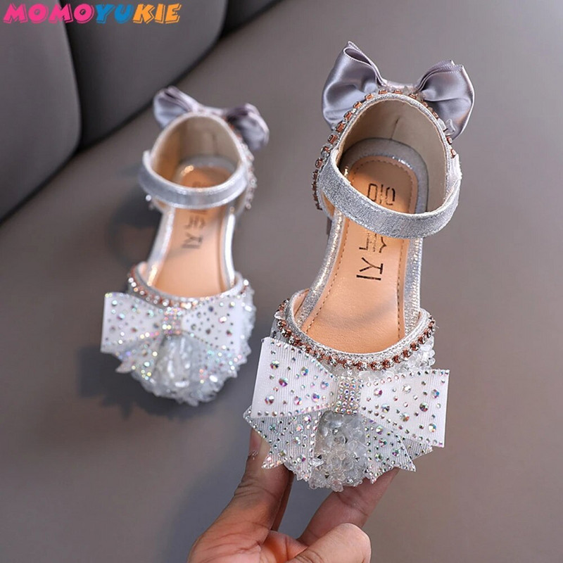 2022. g. Jaunas meiteņu kurpes Bērnu snieguma apavi Sequins Rhinestone Princess ar tauriņmezglu plakaniem apaviem Studentu deju sandales