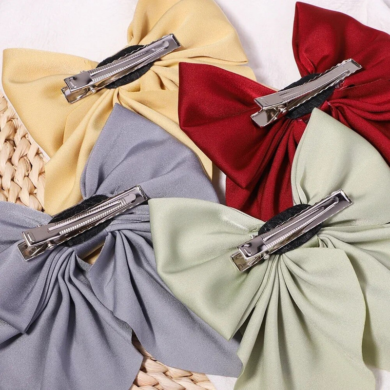 Jaunas Sweet Bow matu sprādzes vienkrāsainas Bowknot matu sprādzes meitenēm Satīns Butterfly Barrettes Duckbill Clip Bērnu matu aksesuāri