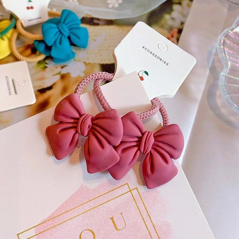 2gab Cute Bowknot elastīgas matu lentes Candy Color Meiteņu matu virve Jauki zirgastes turētājs Taurītes matu kaklasaites bērniem
