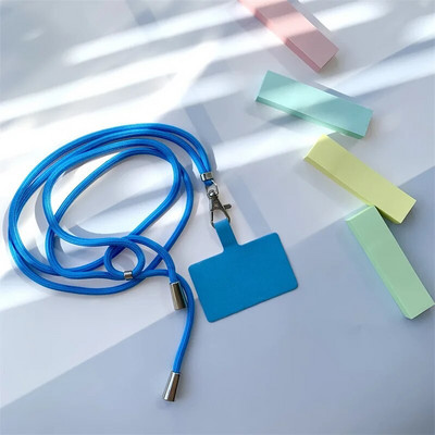 Universāla regulējama tālruņa siksniņa pret nozaudēšanu, noņemama krāsaina kakla vads Tālruņa drošības piesiet atslēgu piekariņa ķēdes virve