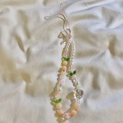 Persiku fāzēm mobilā tālruņa piekariņa siksniņa ķēde Sieviešu saldās meitenes rotaslietas Pērļu mobilā telefona ziedu aukla iPhone atslēgu piekariņam