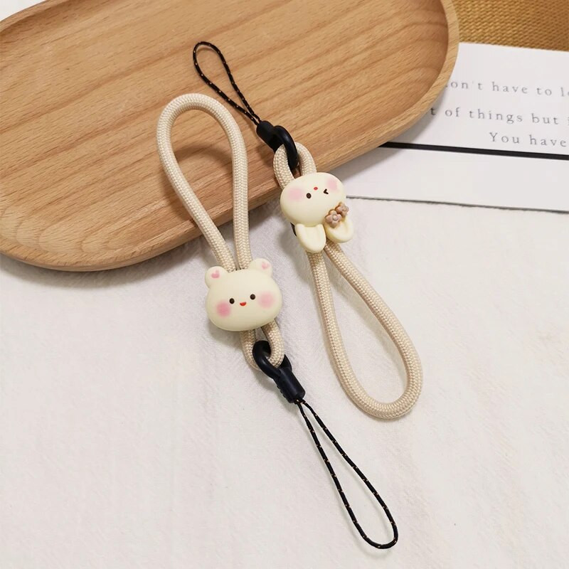 Mobiliojo telefono dirželis, trumpas žiedas, sagtis, pakabukas smėlio spalvos, abrikoso meškiuko pakabukas, nenuleidžiantis pakabukas, saldainis, gėlė, pirštas