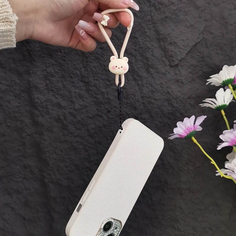 Mobiliojo telefono dirželis, trumpas žiedas, sagtis, pakabukas smėlio spalvos, abrikoso meškiuko pakabukas, nenuleidžiantis pakabukas, saldainis, gėlė, pirštas