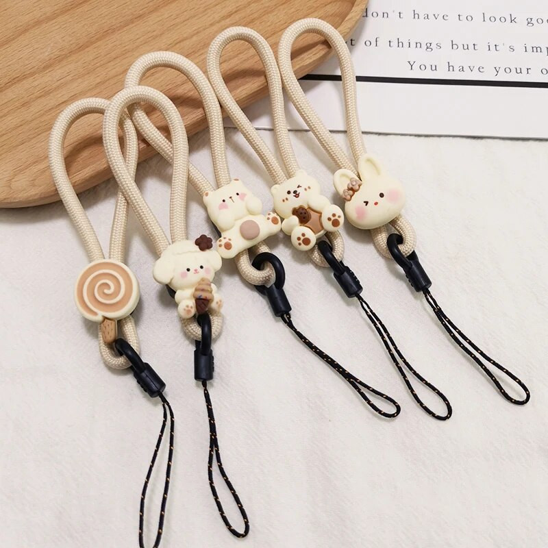 Mobiliojo telefono dirželis, trumpas žiedas, sagtis, pakabukas smėlio spalvos, abrikoso meškiuko pakabukas, nenuleidžiantis pakabukas, saldainis, gėlė, pirštas