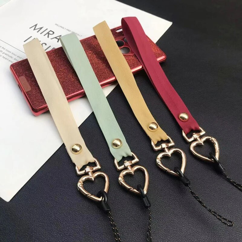 Jauna modes sirds tālruņa aukla sievietēm Tālruņa plaukstas vads Pretnozaudēšanas štropes siksniņa Tālruņa drošības saite Atslēgu piekariņa ķēdes virve