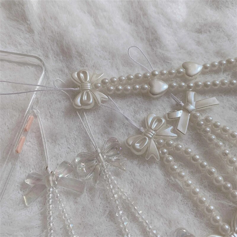 Korejas tālruņa siksniņa Rokassprādze Caurspīdīga kristāla Bowknot Pērlītes Iekarināms Vads Mobilais Mugursoma Kulons Virves šarms Aksesuāri