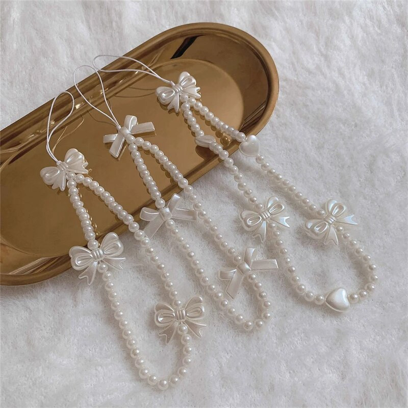 Korejas tālruņa siksniņa Rokassprādze Caurspīdīga kristāla Bowknot Pērlītes Iekarināms Vads Mobilais Mugursoma Kulons Virves šarms Aksesuāri