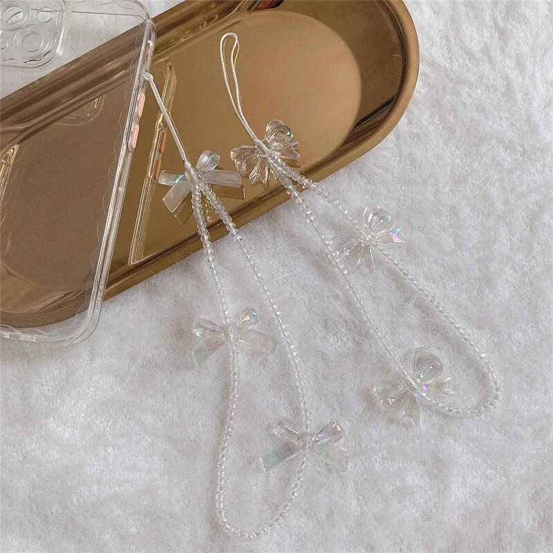 Korejas tālruņa siksniņa Rokassprādze Caurspīdīga kristāla Bowknot Pērlītes Iekarināms Vads Mobilais Mugursoma Kulons Virves šarms Aksesuāri