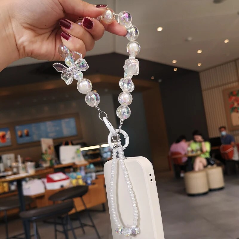 Kratki privjesak sa šarenom leptir mašnom i privjeskom s perlama Univerzalna telefonska torbica s kopčom koja se ne spušta Uzica za mobilni telefon