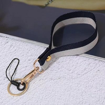 Divu krāsu tālruņa auklas plaukstas siksniņa Virve apaļš kulons Pretnozaudēšanas auklas rokassprādze Mobilā tālruņa futrālis Sling pārnēsājams atslēgu piekariņš