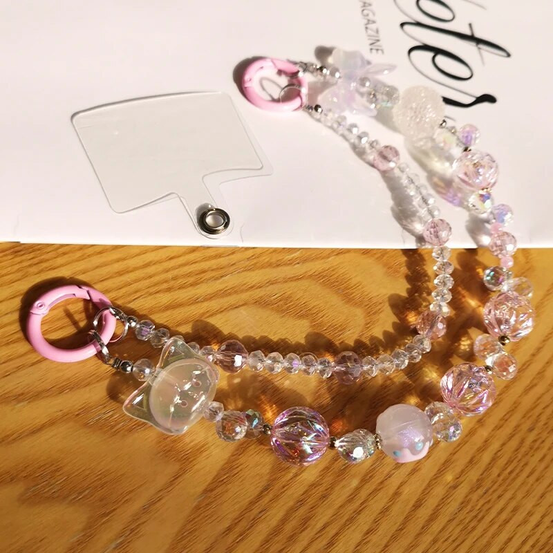 Īsas kristāla pērlītes Mazas meitenes plaukstas locītava, piekarināma ķēde mobilā tālruņa auklas stiprinājuma stils, dubultā ķēdes tālruņa futrālis pret zudumu