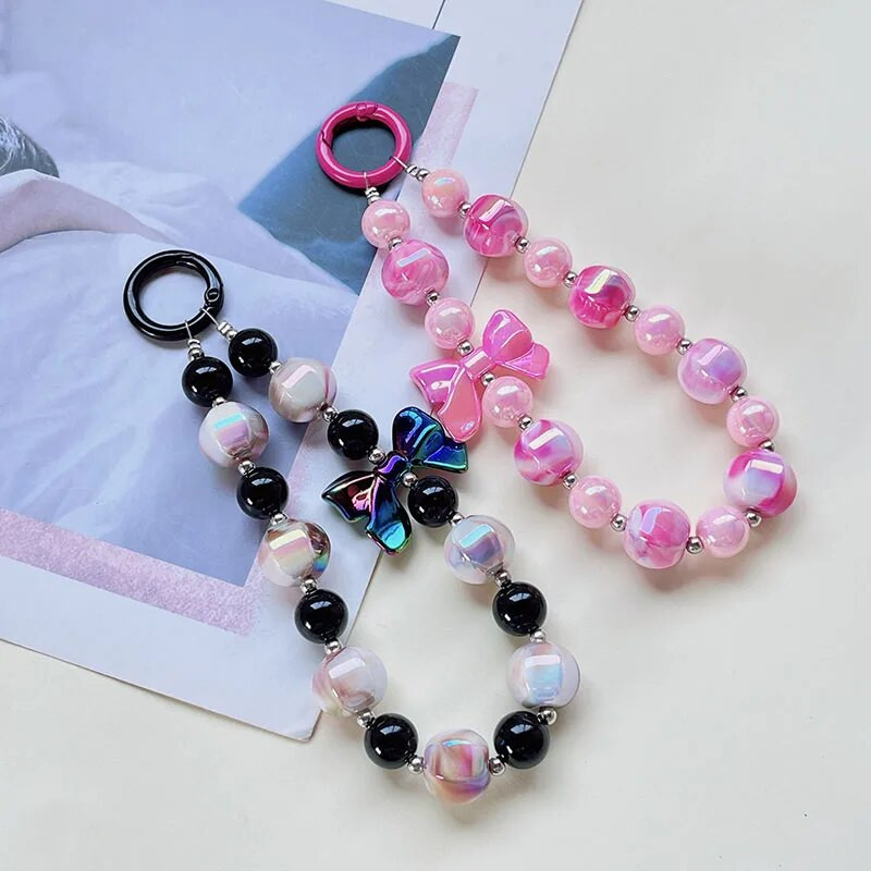 Radoša roku darbs ar pērlītēm mobilā tālruņa ķēde Divu krāsu žilbinoša Bowknot Pērlīšu rokassprādze Jauki mugursomas dekori Mobilā tālruņa futrāļa ķēdes