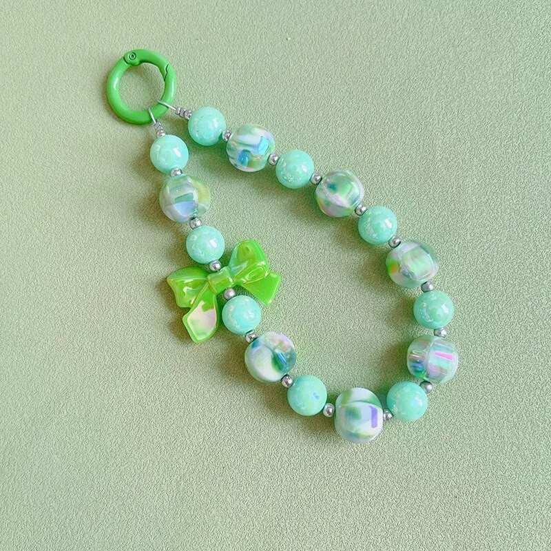 Radoša roku darbs ar pērlītēm mobilā tālruņa ķēde Divu krāsu žilbinoša Bowknot Pērlīšu rokassprādze Jauki mugursomas dekori Mobilā tālruņa futrāļa ķēdes