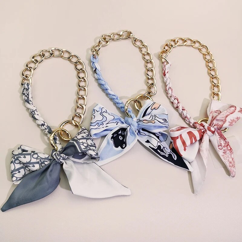 Kõrgekvaliteediline kott-telefoni ümbris, kaotsiminekuvastane pael, kaelarihm, võti, mobiiltelefon, kaelarihm, siidist sall, rippuv kett, punutud vibu metallist ripats