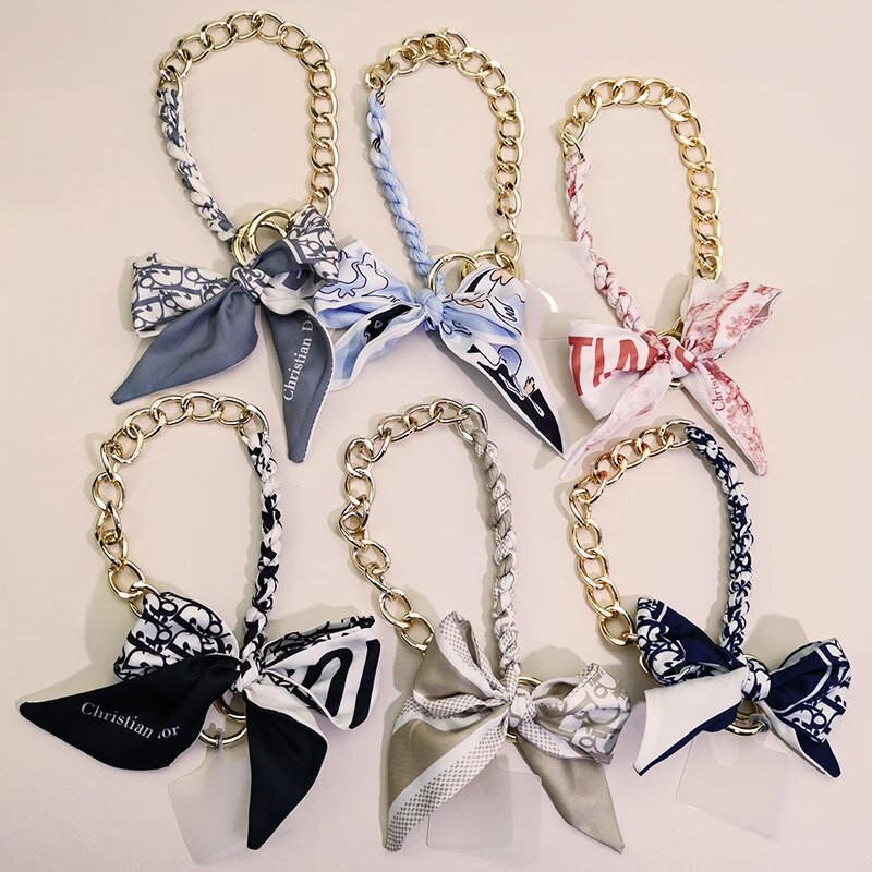 Kõrgekvaliteediline kott-telefoni ümbris, kaotsiminekuvastane pael, kaelarihm, võti, mobiiltelefon, kaelarihm, siidist sall, rippuv kett, punutud vibu metallist ripats