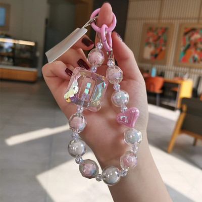 Liela kvadrātveida kristāla pērlīšu plaukstas siksna mobilā tālruņa siksna ar daudzpusēju dimanta pērlīšu kulonu tālruņa pret nokrišanu klipšu stila siksniņa