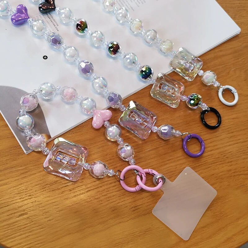 Liela kvadrātveida kristāla pērlīšu plaukstas siksna mobilā tālruņa siksna ar daudzpusēju dimanta pērlīšu kulonu tālruņa pret nokrišanu klipšu stila siksniņa