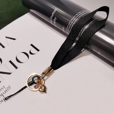 Mobilā tālruņa aukla sieviešu plaukstas virve plata auduma īsa štrope siksniņa kulonu apvalka rotājumi pārnēsājams noņemams atslēgu piekariņš