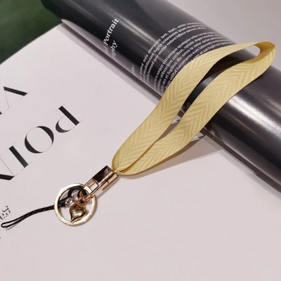 Mobilā tālruņa aukla sieviešu plaukstas virve plata auduma īsa štrope siksniņa kulonu apvalka rotājumi pārnēsājams noņemams atslēgu piekariņš