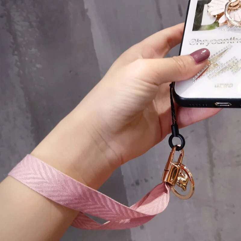 Mobilā tālruņa aukla sieviešu plaukstas virve plata auduma īsa štrope siksniņa kulonu apvalka rotājumi pārnēsājams noņemams atslēgu piekariņš