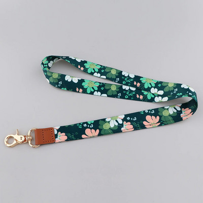 Ransitute R2801 Fashion Flowers Serie Ādas sprādzes Virves emblēmas ID Virves Tālruņa virve Atslēgas Virves kakla siksnas aksesuāri