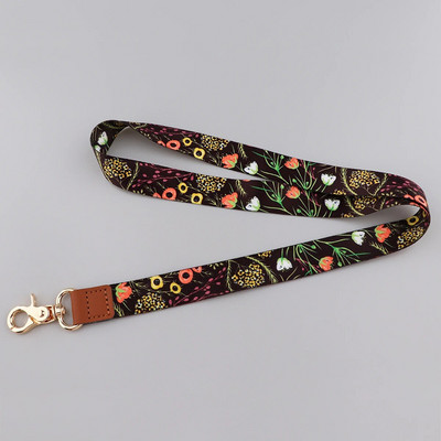 Ransitute R2801 Fashion Flowers Serie Ādas sprādzes Virves emblēmas ID Virves Tālruņa virve Atslēgas Virves kakla siksnas aksesuāri