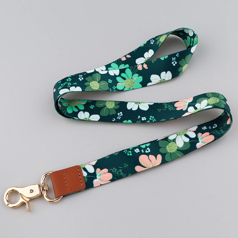 Ransitute R2801 Fashion Flowers Serie Ādas sprādzes Virves emblēmas ID Virves Tālruņa virve Atslēgas Virves kakla siksnas aksesuāri