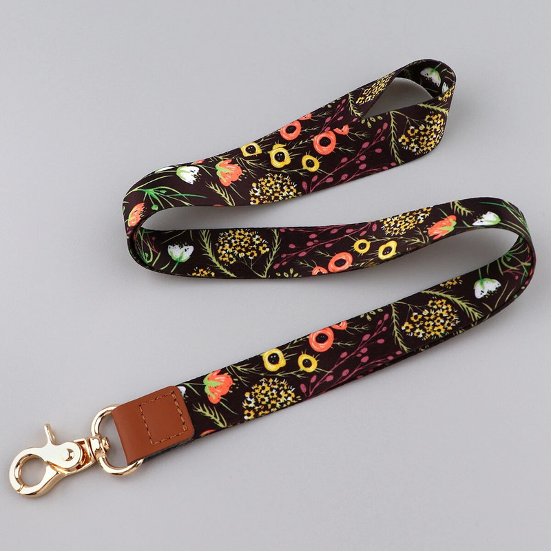 Ransitute R2801 Fashion Flowers Serie Ādas sprādzes Virves emblēmas ID Virves Tālruņa virve Atslēgas Virves kakla siksnas aksesuāri