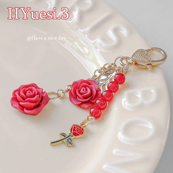 8 цвята 3D Rose Camellia Keychain Women Girls Sweet Pearl Tassel Flower Ключодържател с метални листа за калъф за слушалки Декорация на чанта
