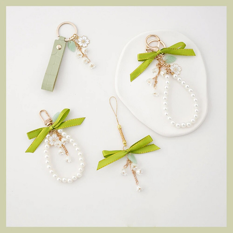 Modes lentes priekšgala pērļu piekarināmais atslēgu piekariņš iPhone tālrunim Samsung sievietēm mobilā tālruņa soma Automašīnas atslēgu piekariņš šarmu dekoru vairumtirdzniecība