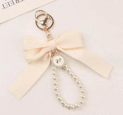 Jauns liels loks atslēgu piekariņš, pērļu atslēgu piekariņš, automašīnas kulons, radošs krāsains lentes audums, mezgls atslēgu piekariņu aksesuāri K5192