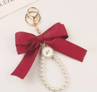 Jauns liels loks atslēgu piekariņš, pērļu atslēgu piekariņš, automašīnas kulons, radošs krāsains lentes audums, mezgls atslēgu piekariņu aksesuāri K5192