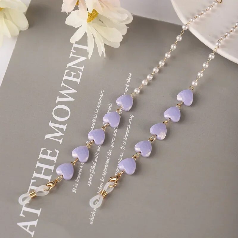 Krāsu Mīlestības Briļļu ķēde Viss vienā pērļu sirds formas maska Austiņas Pretzaudējumu vairumtirdzniecība Saulesbriļļu ķēde Sievietēm