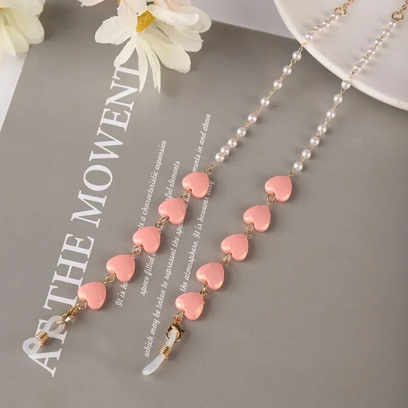 Krāsu Mīlestības Briļļu ķēde Viss vienā pērļu sirds formas maska Austiņas Pretzaudējumu vairumtirdzniecība Saulesbriļļu ķēde Sievietēm