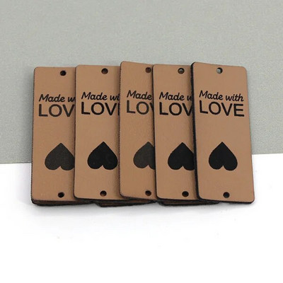 20 tk, mis on valmistatud armastussiltidega Käsitsi valmistatud silt Kunstlik PU-nahast sildid rõivastele Käsitsi valmistatud sildid mütside jaoks kootud õmblemine