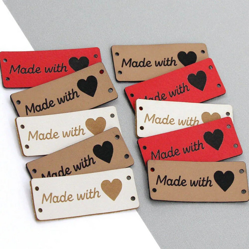 20 tk, mis on valmistatud armastussiltidega Käsitsi valmistatud silt Kunstlik PU-nahast sildid rõivastele Käsitsi valmistatud sildid mütside jaoks kootud õmblemine