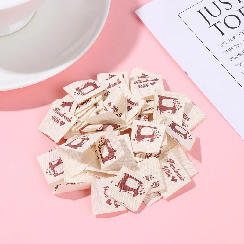 50 vnt. rankų darbo su meilės audeklu Drabužių etiketės Mezgimas vilnos rutuliukai Drabužių etiketės Animacinių filmų katės širdies raštas austi megzti reikmenys