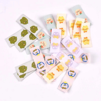 50Gb Karikatūras Dinozauru/Pingvīnu Etiķetes Apaviem Kopšanas somām Šūšana Apģērbs Roku darbs Piederumi DIY Amatniecība Audums Apģērbu Birkas