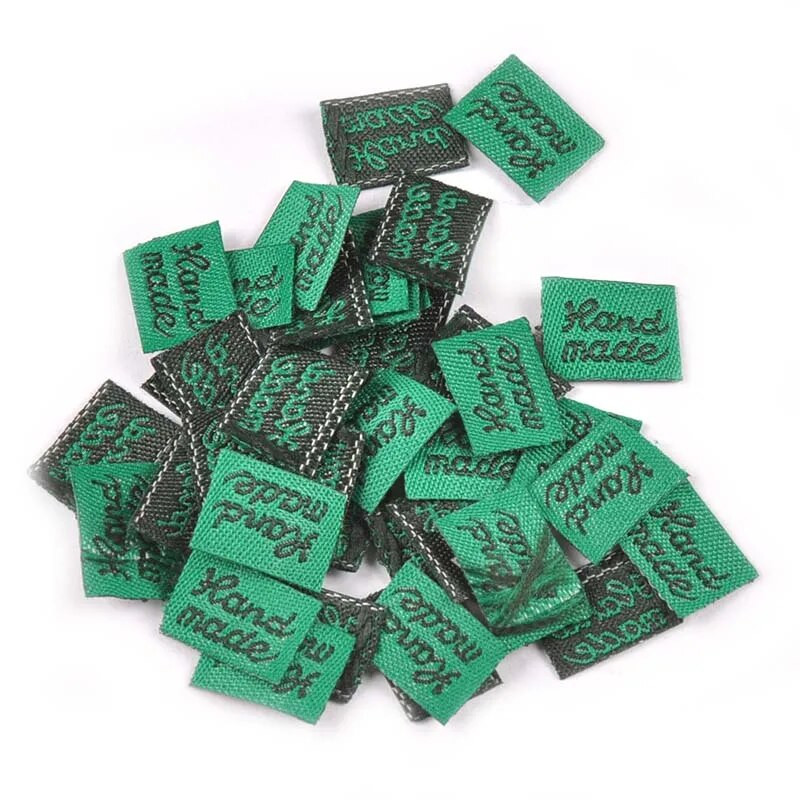 100 tk/kott Tikitud riidest sildid DIY rõivakotid rõivaste jaoks Reljeefse lipuga õmblussildid Käsitsi valmistatud tarvikud 11x15 mm C2393