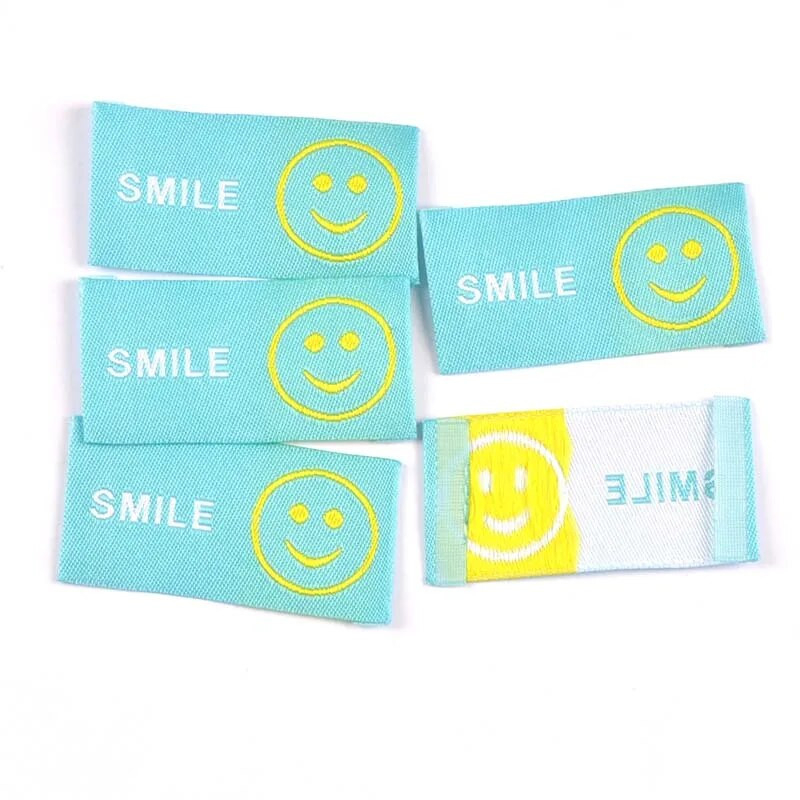 50 τμχ 49x25 χιλιοστά Νέο χαμόγελο κέντημα Ετικέτες ενδυμάτων για DIY ρούχα προμήθειες Χειροποίητα αξεσουάρ ραπτικής Ετικέτες πλεξίματος