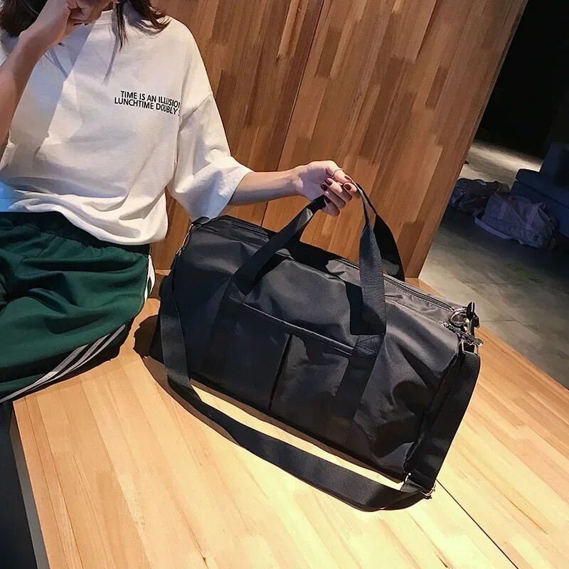 Ūdensnecaurlaidīga neilona ceļojumu soma 2023. gada jauna sieviešu rokassomu ceļojumu uzglabāšanas glabāšana sporta diagonālā soma apavu kastes bagāžas soma