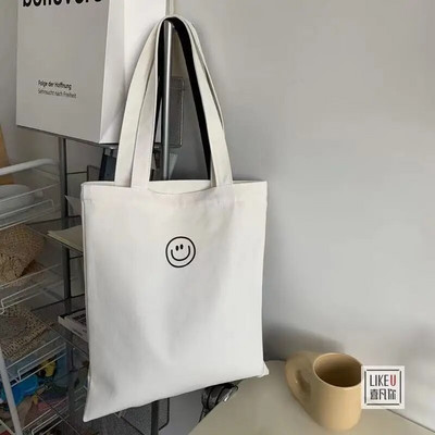 Naiste lõuendist õlakott naeratava näoprindiga Naiste vabaaja käekott Kandekott Suure mahutavusega puuvillane korduvkasutatav ostukott