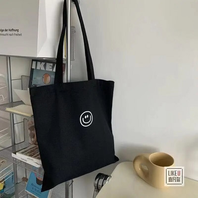 Naiste lõuendist õlakott naeratava näoprindiga Naiste vabaaja käekott Kandekott Suure mahutavusega puuvillane korduvkasutatav ostukott