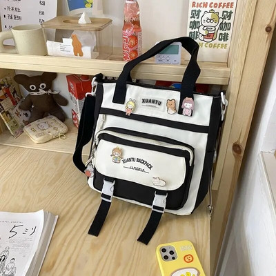 Õpetuskotid Naiste kolledži üliõpilaste lõuendist käekotid ülikoolilinnakus õppimiseks ja klassiruumi moe jaoks Korea versioon Crossbody kott
