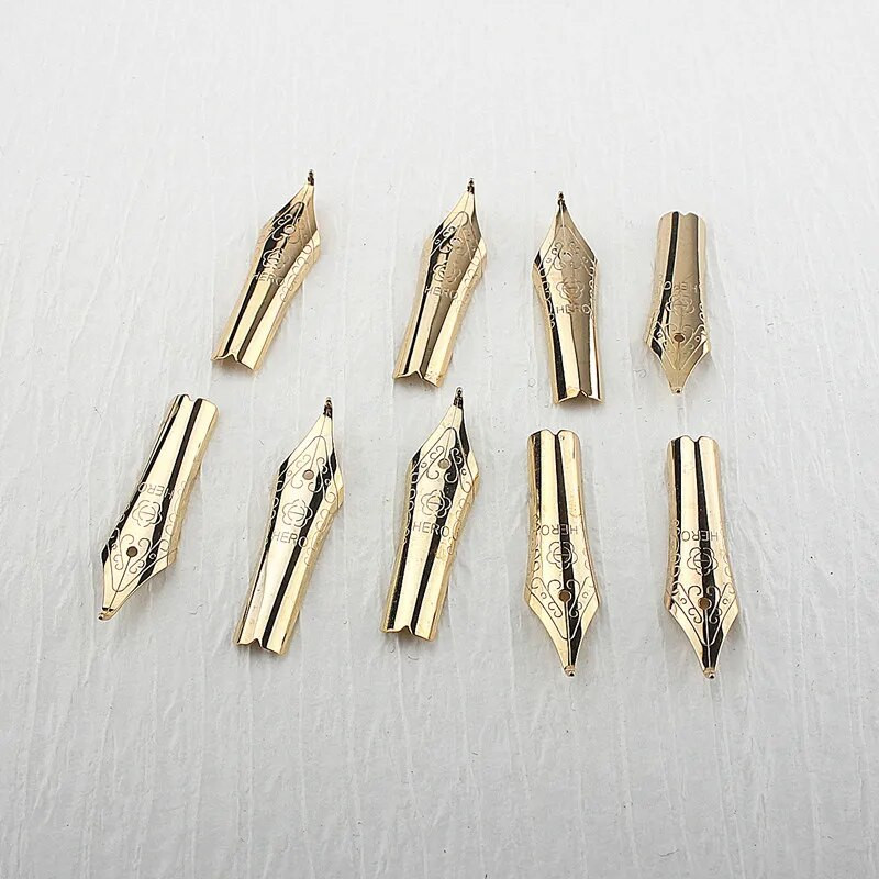 4 tk Hero täitesulepea, 26 otsaga kuldne paljude seeriate jaoks, mida saab vahetada kirjatarbed õpilaste kontoritarbed