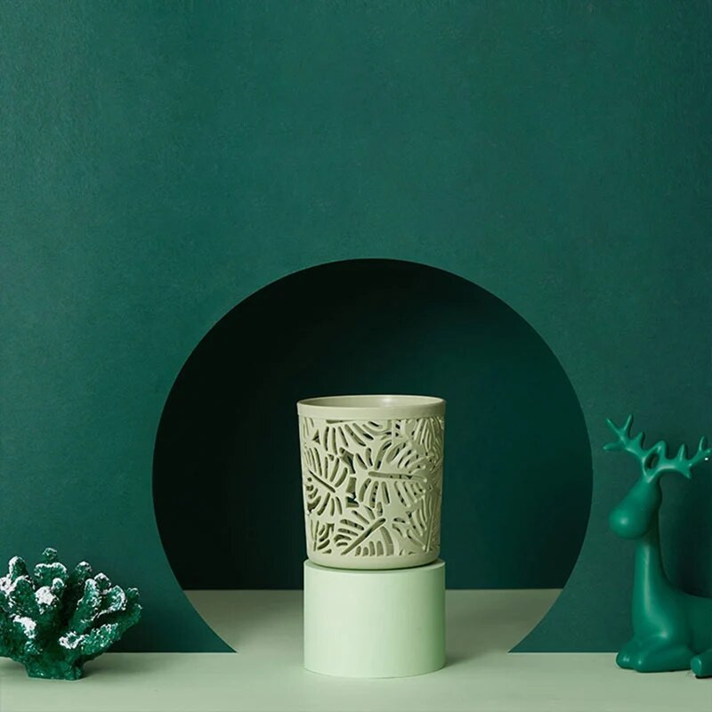 Silindriline kirjatarvete hoiustamiskonteiner Kontori koolitarvete jaoks Põhjamaade õõnsate lilledega meigipintslite pliiatsihoidja